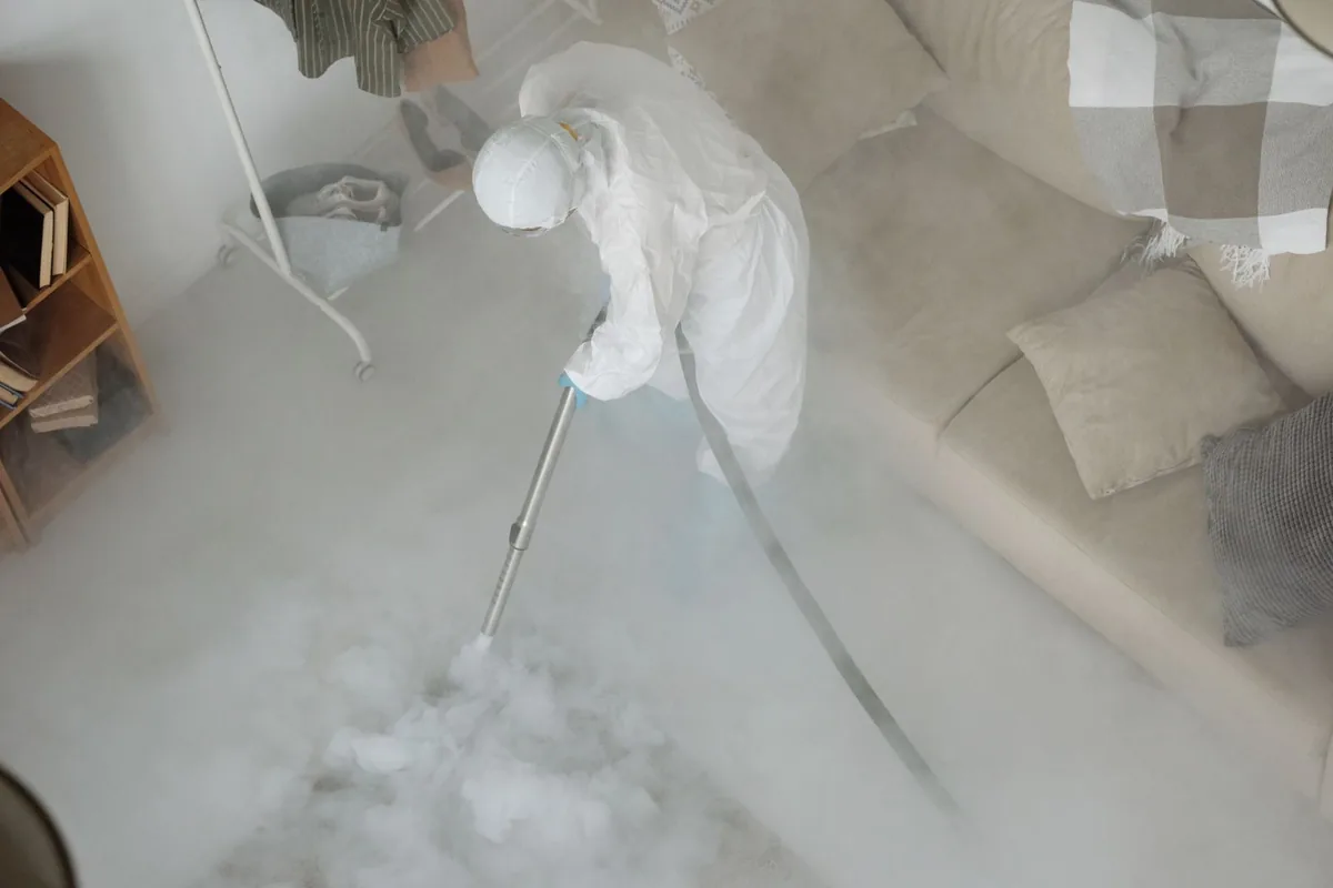 Biohazard cleanup technician in protective equipment, Craigsville, WV